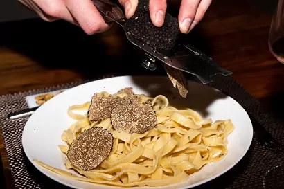 preparing pasta with truffles